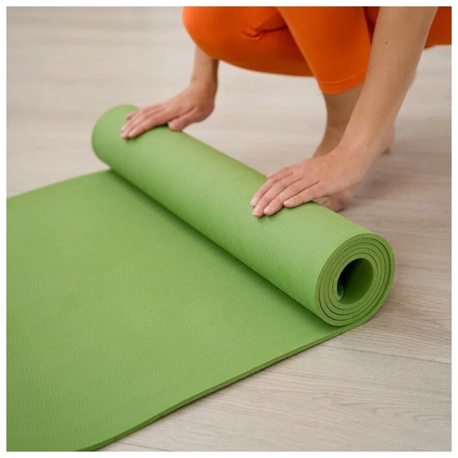 Rolling up a Pilates mats