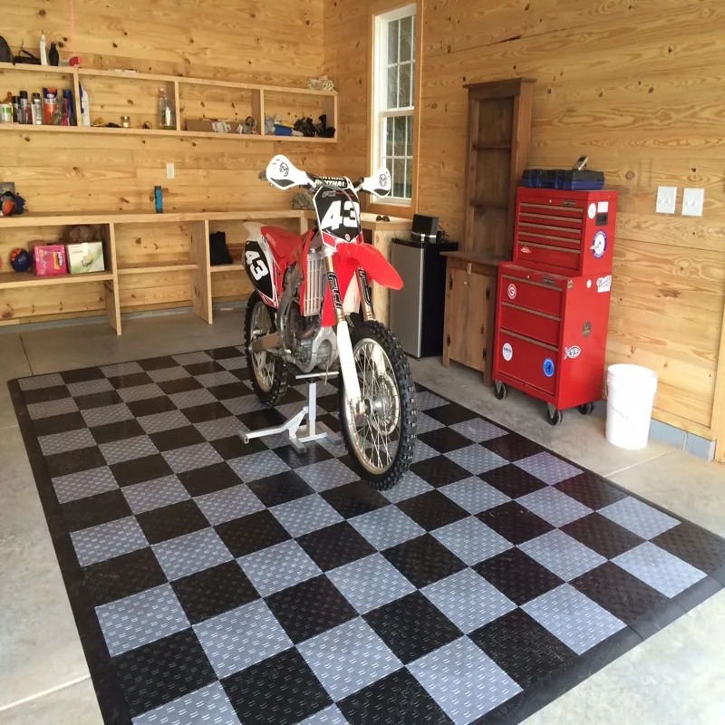 Dubai garage featuring Black and gray interlocking floor mats.