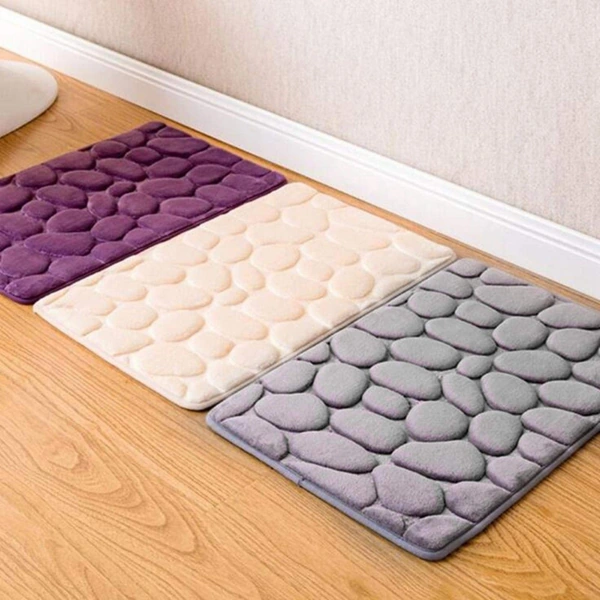 Purple,beige, gray cobblestone-patterned bath mats on floor