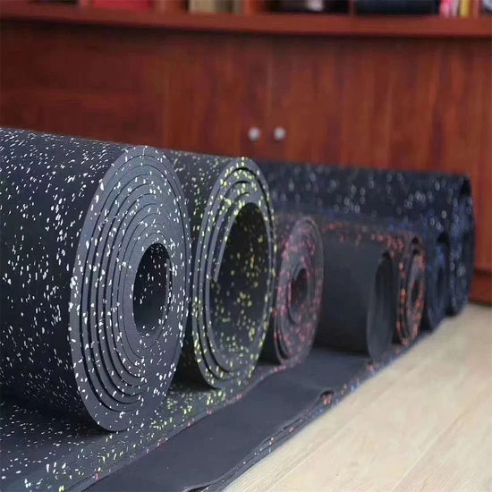 Thick speckled black rubber flooring roll standing upright (2)