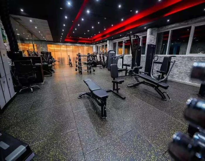 A gym with speckled rubber floor tiles