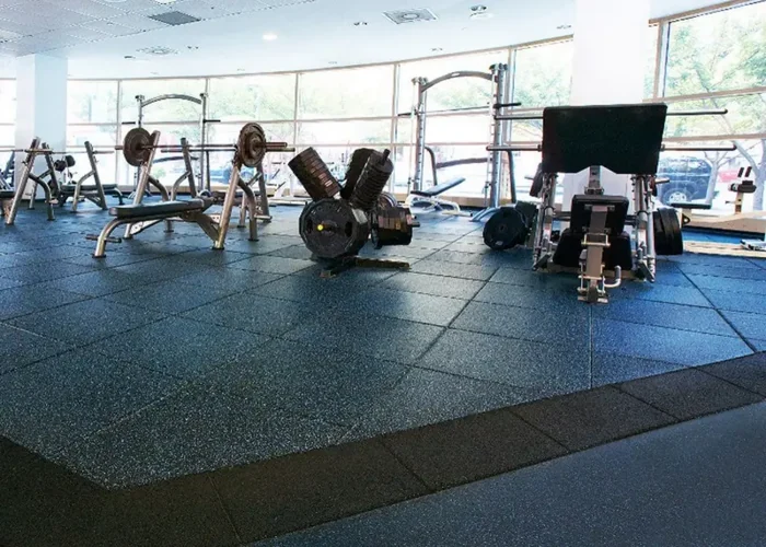 bright gym with blue speckled rubber floor tiles