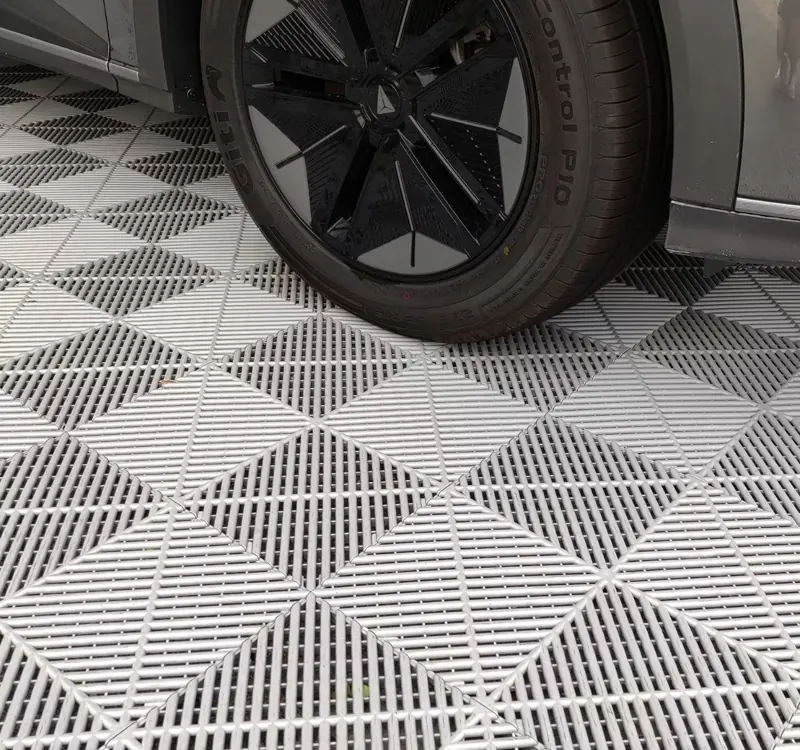 Garage flooring tiles in Dubai car wheel on top