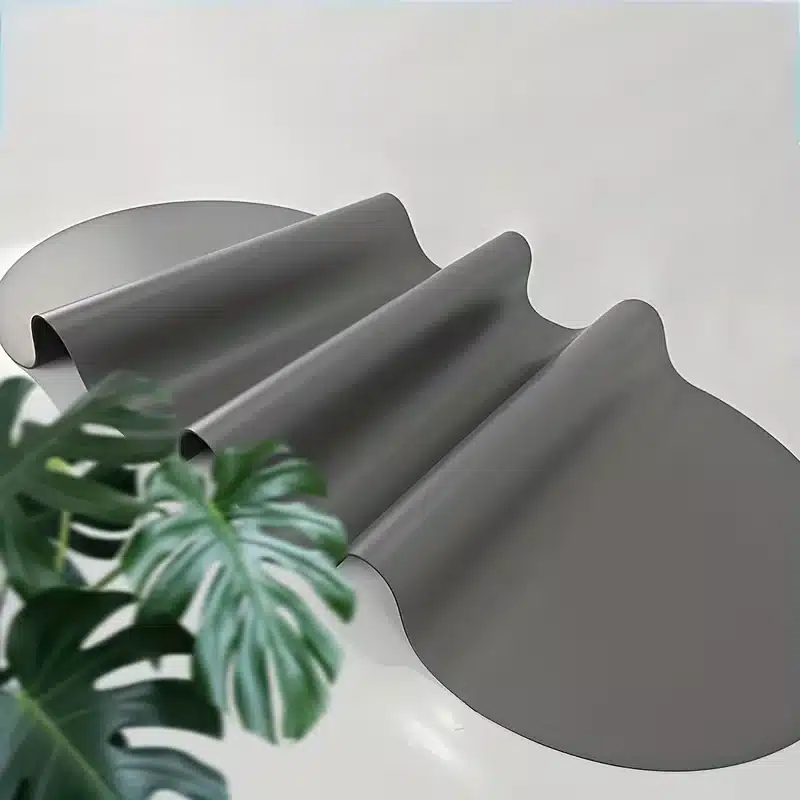Rolled dark grey oval yoga mat studio